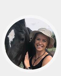 Cori with a horse that she may or may not ride